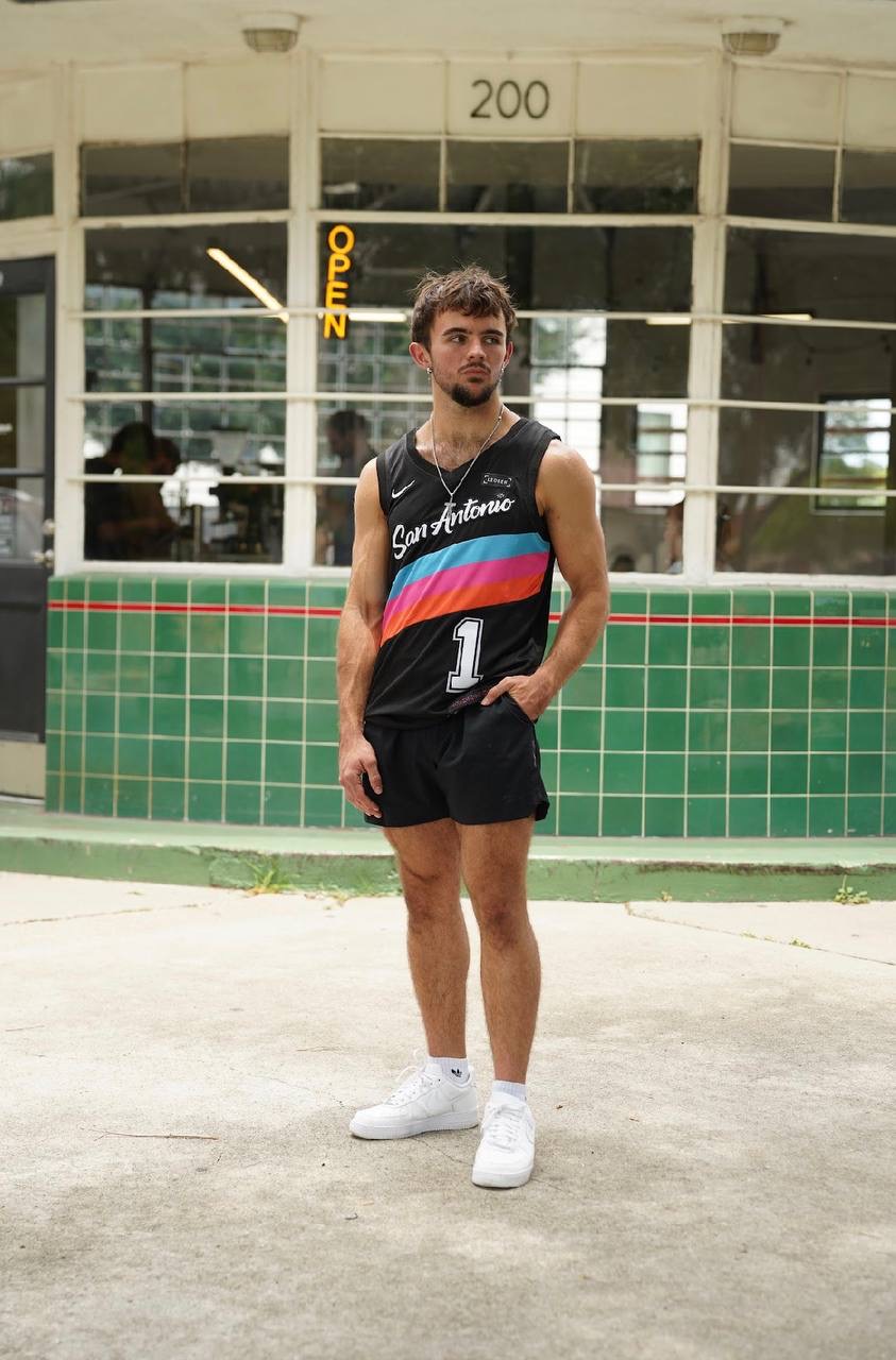 Person wearing a black San Antonio number 1 basketball jersey