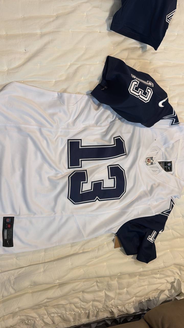 White and navy Dallas number 13 football jersey laid flat
